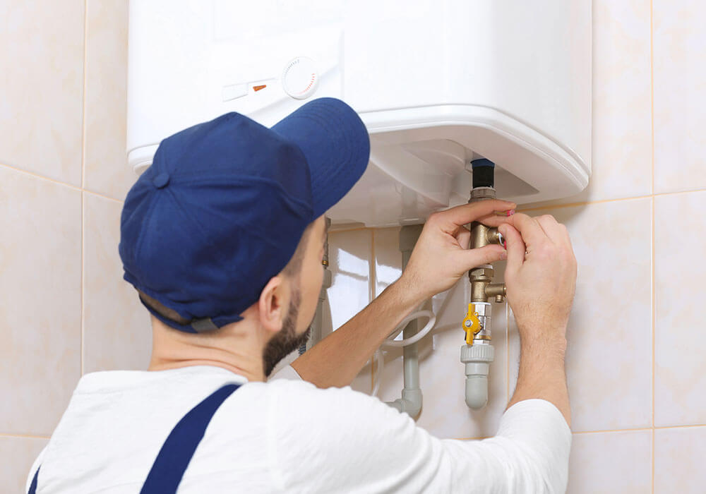 Superior Plumbing and Drains Plumber Installing Water Heater